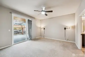 Primary bedroom with sliding glass door out to your covered patio