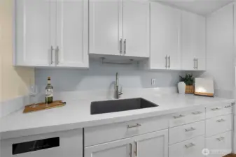 Ample cabinet space spans the entire kitchen.