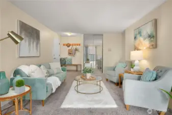Spacious living area is bathed in natural light, creating a warm and inviting atmosphere.