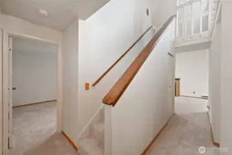 Stairs to the open loft office and bedroom space