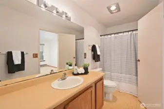 Full bath has access from hall and primary bedroom.