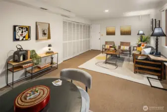 This downstairs living space connects to the studio/art room/hobby space through the door seen in the photo.