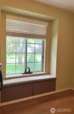 First bedroom with window seat that opens up for storage