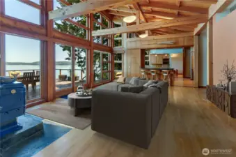 Virtually staged great room with wall of glass keeps you visually connected to the outdoors.
