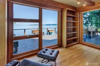 Main floor reading area in library with an abundance of natural light.