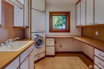 Laundry room as a sink, natural light and tons of convenient storage!