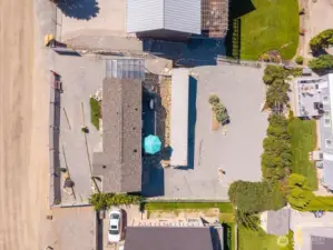 Aerial overhead view of home and outdoor living area.