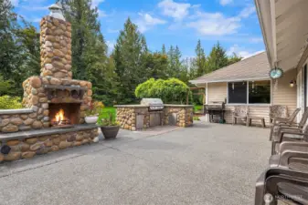 Large entertaining patio with fireplace and plumbed BBQ