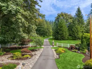 Driveway into home with private gated entrance