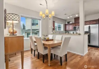 Hardwood flooring in the dining space and kitchen
