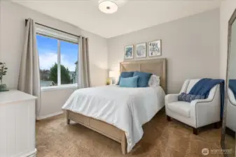 Primary suite with tall ceilings and attached bathroom