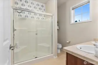 3/4 primary bathroom with stylish touches