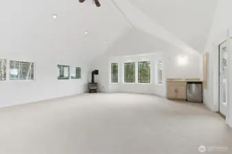 Second floor rec room with propane fireplace and wet bar