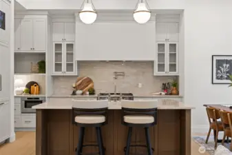 The materials elevate the experience of true luxury with continuous Taj Mahal Quartzite countertops, wide-plank European Oak flooring, custom white oak doors and millwork, designer lighting, and premium hardware.