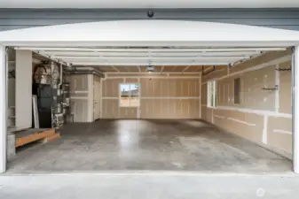 Expansive two-car garage with room to park and still carve out space for a home gym and your Peloton