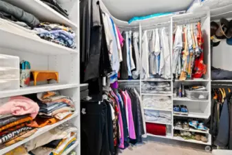 Lots of storage in the primary walk-in closet with organizers