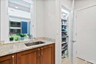 Sink & tons of extra storage in the laundry room