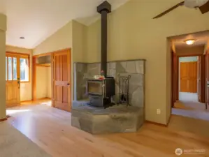 The custom fireplace with built in bench. German Birch hardwood floor have been recently refinished. office space and g=bedrooms down the hall.