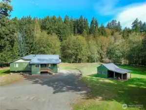 Level sunny location with 250ft of secluded river front on the Little Quilcene River.