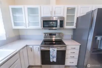 quartz tops, all new appliances n your beautiful kitchen