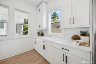So much storage in the kitchen! (staging and furniture are for decoration and not included in the sale of this home)