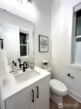 Main floor powder (staging and furniture are for decoration and not included in the sale of this home)