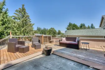 The elevated deck has a filtered Seattle view, great place to spend those long summer days.