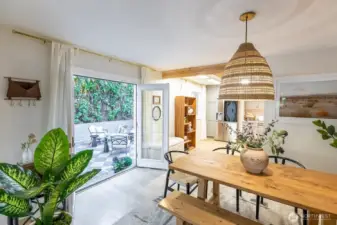Open dining space with French doors leading to the patio