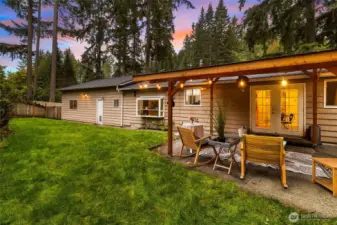 Rear patio is lighted and has a fire pit for warmth in winter.