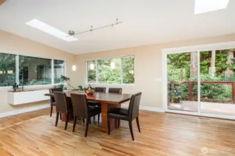 Massive dining area with built in buffet cabinet and slider to back deck.