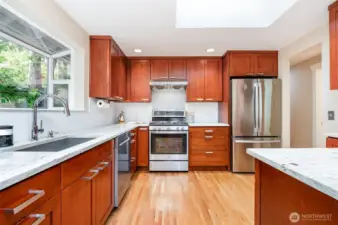 Timeless cabinetry, stainless appliances and ample counter space is a delight for any chef.