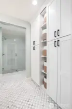 Additional storage abounds in the primary bath