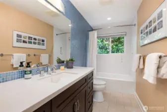 Whimsical tile in the large, updated main floor full bath.
