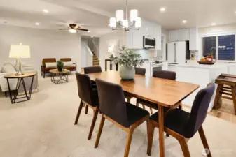 Ideal open concept living with thoughtful updates, like ceiling fans, lighting on dimmer switches throughout the home and more.