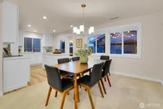 So many windows! Kitchen door leads to charming patio for easy access to your grill and the detached garage.