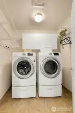 Walk in pantry does double duty as laundry space. Elfa shelving system makes organization and storage easy.