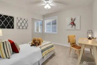 Spacious third bedroom with mirrored closet doors. Yes, there is a shelving system behind them!