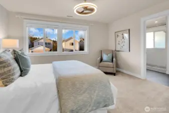 Primary suite leading to spa-inspired bath. Notice that the custom millwork continues throughout the home.