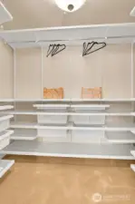 Primary walk-in closet with amazing storage and room for it all!!