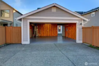 Pull into the detached garage and it is just a few steps to the kitchen door. Notice the brand new epoxy garage floor!