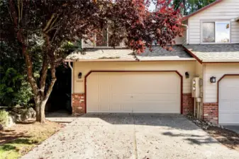 Front of home featuring two car attached garage.