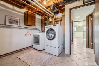 Laundry space with access to patio and backyard.