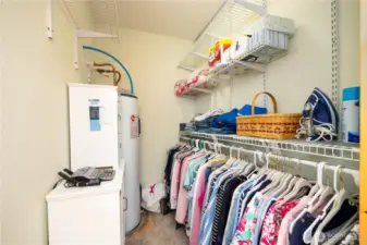 Larger view of walk in closet in the primary bedroom.