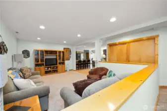 Looking from the hallway through the living room.  Pantry/double closet in hallway provides ample space for many supplies.