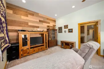 Currently used for watching sports and relaxing on one end, while the other end is set up for an office.