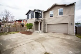 Two car garage with plenty of additional uncovered parking.
