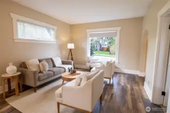 The large bay window in the front of the home beautifully frames the cherry blossoms, currently in bloom.