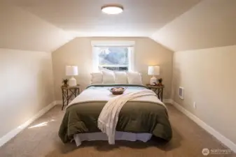 The upstairs primary bedroom is spacious and private - a true santuary!