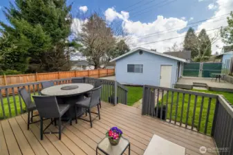 The expansive, trex deck right off the utility room offers a bright, open space for entertaining and relaxation. The low maintenance material is easy to clean and is built to last!
