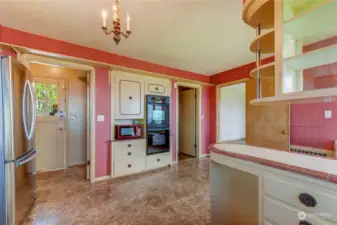 Kitchen has a stainless refrigerator and double oven